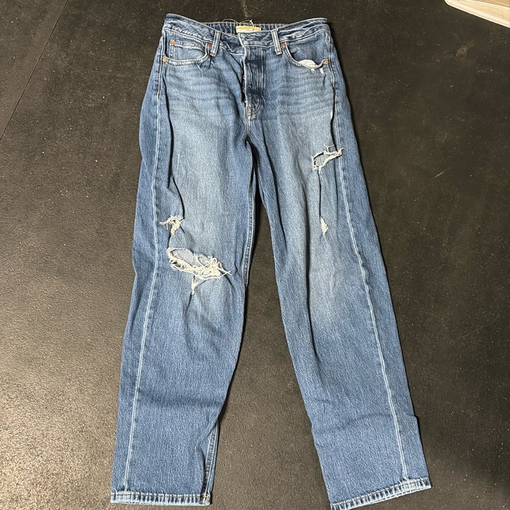 Maurices 12 Long button up in the front with some holes on the knee